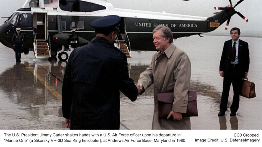 The U.S. President Jimmy Carter shakes hands with a U.S. Air Force officer upon his departure in